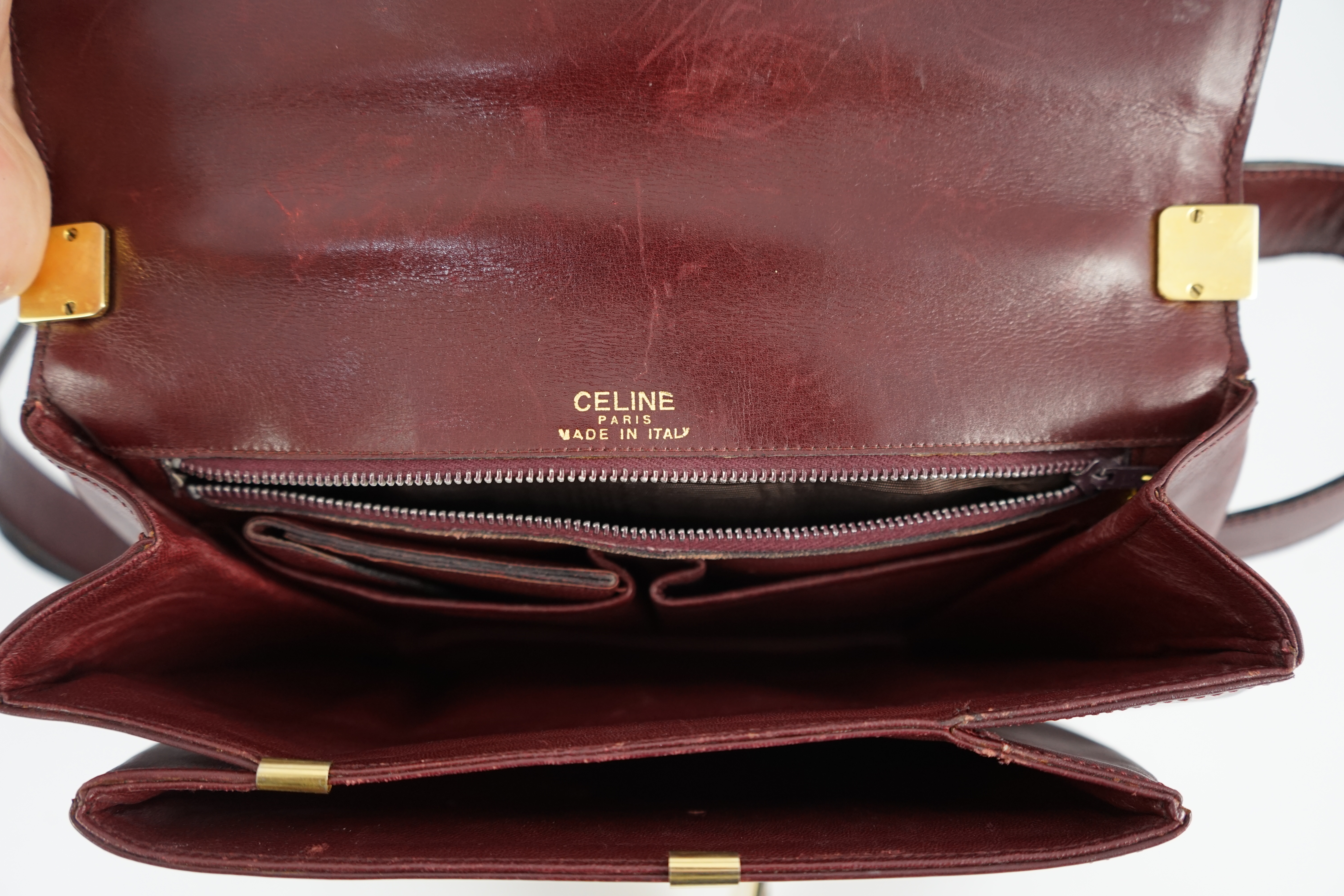 A vintage Celine horse carriage cargo flap burgundy leather shoulder bag, width 26cm, depth 3cm, height 18.5cm